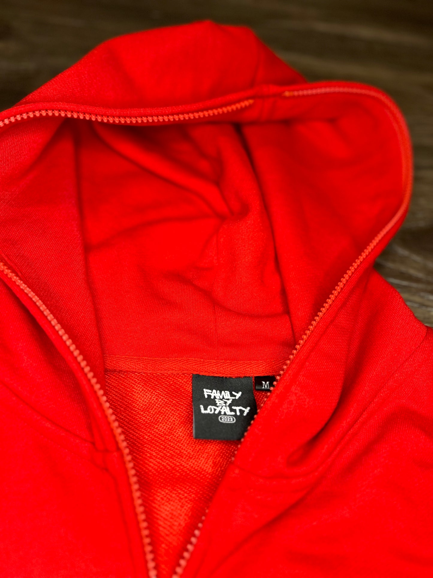 Red zip-up Broken Love Jacket